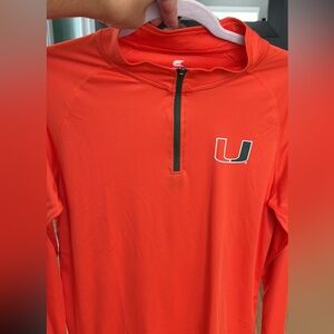 UM Quarter Zip “dry fit” material.